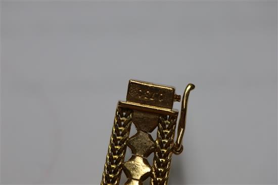 A ladys 20th century Piaget 18ct gold and graduated cultured pearl set manual back wind cocktail watch,